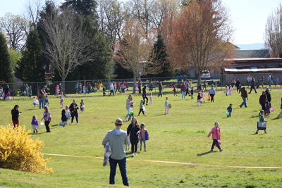 Kids in Field Looking for Easter Eggs