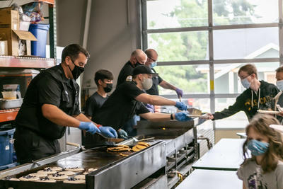 Firefighter cooking pancakes