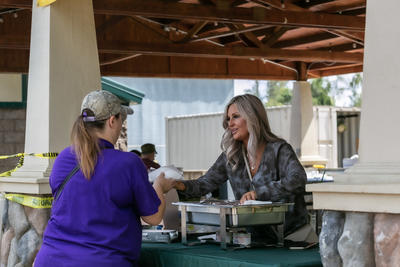 woman serving corn 